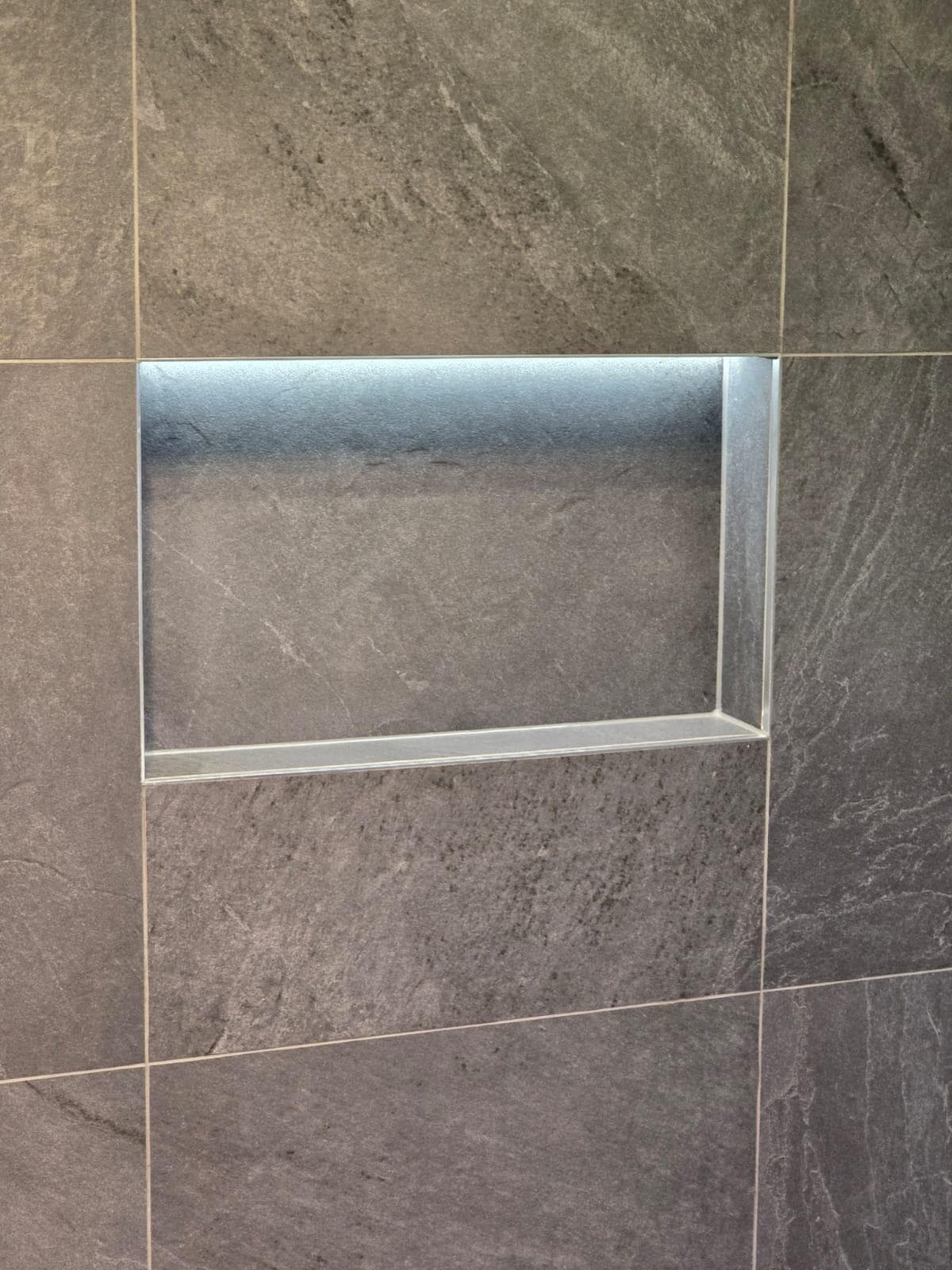 Modern bathroom niche with grey tiles in Canberra, Australia
