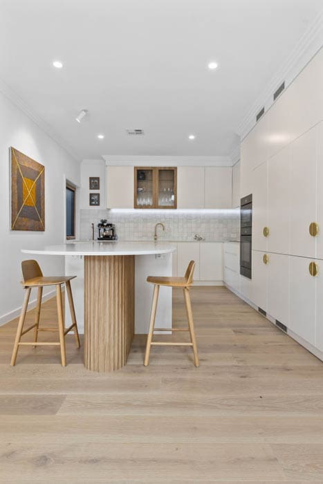 Modern kitchen renovation in Canberra, Australia with sleek design and natural finishes.