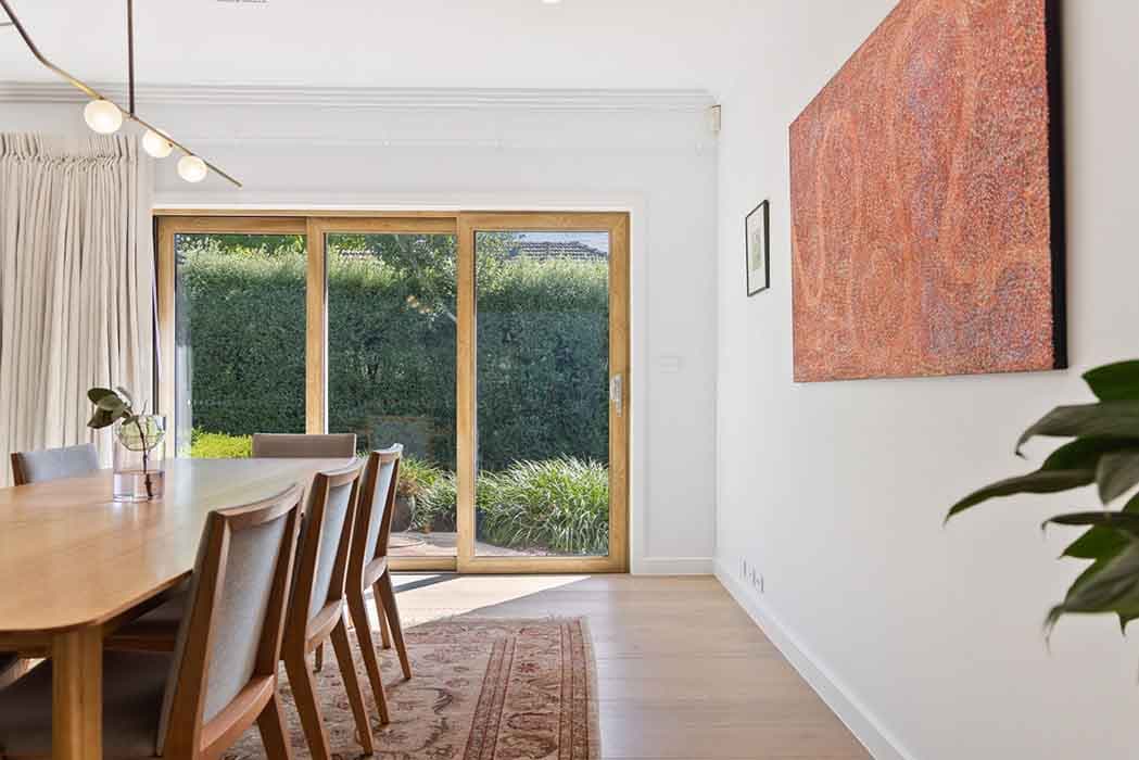 Modern dining area renovation in Canberra, Australia with natural light and stylish decor.