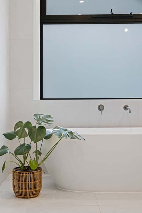 Modern bathroom renovation in Canberra, Australia with freestanding tub and natural light
