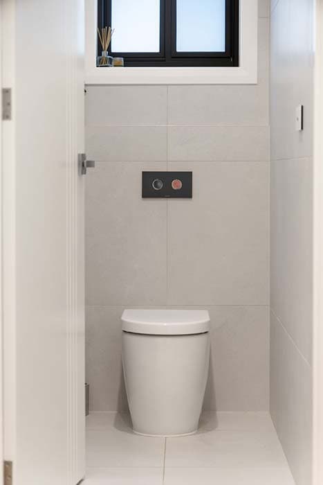 Modern bathroom renovation in Canberra, Australia with sleek design and efficient layout.