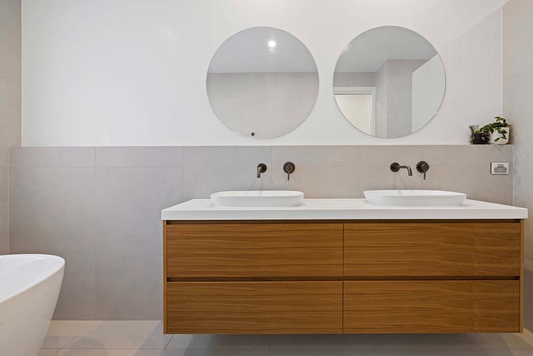 Modern bathroom renovation in Canberra, Australia with stylish finishes and fixtures.