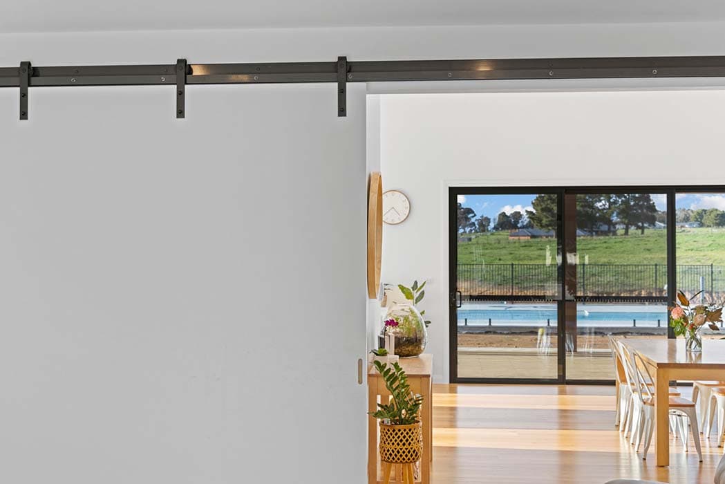 Modern interior with sliding barn door in Canberra, Australia