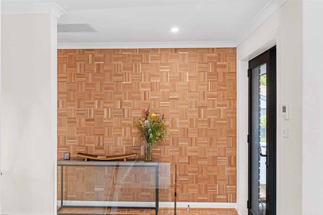 Stylish entryway renovation in Canberra with wood paneling and modern decor