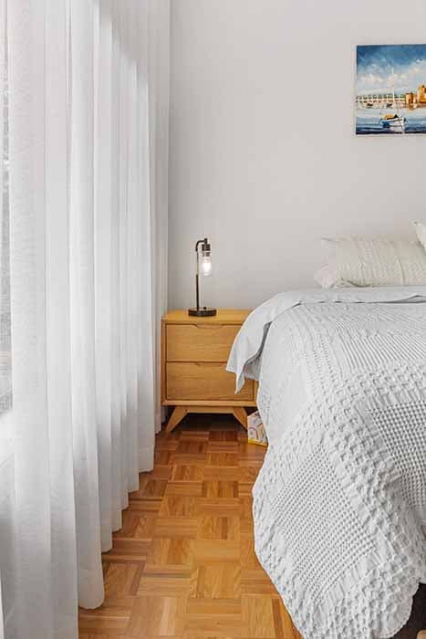 Modern bedroom renovation in Canberra, Australia with elegant finishes and natural light.