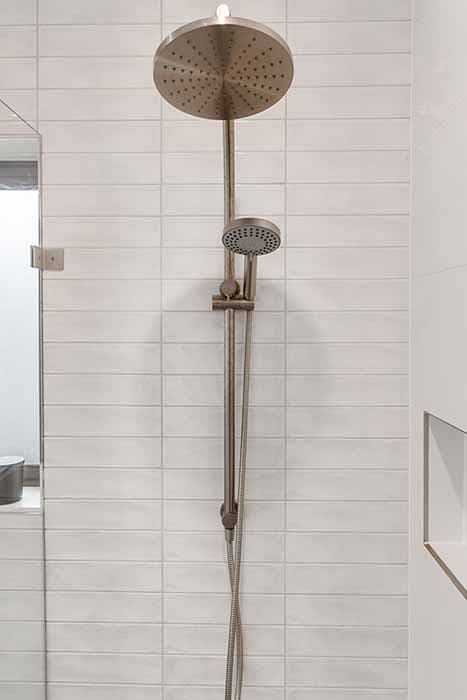 Modern shower design in Canberra, Australia with sleek fixtures and elegant tiles.