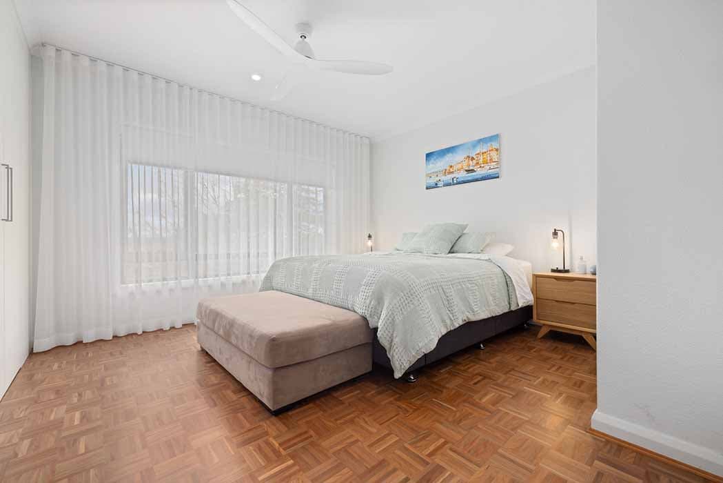 Modern bedroom renovation in Canberra, Australia with natural light and elegant finishes.