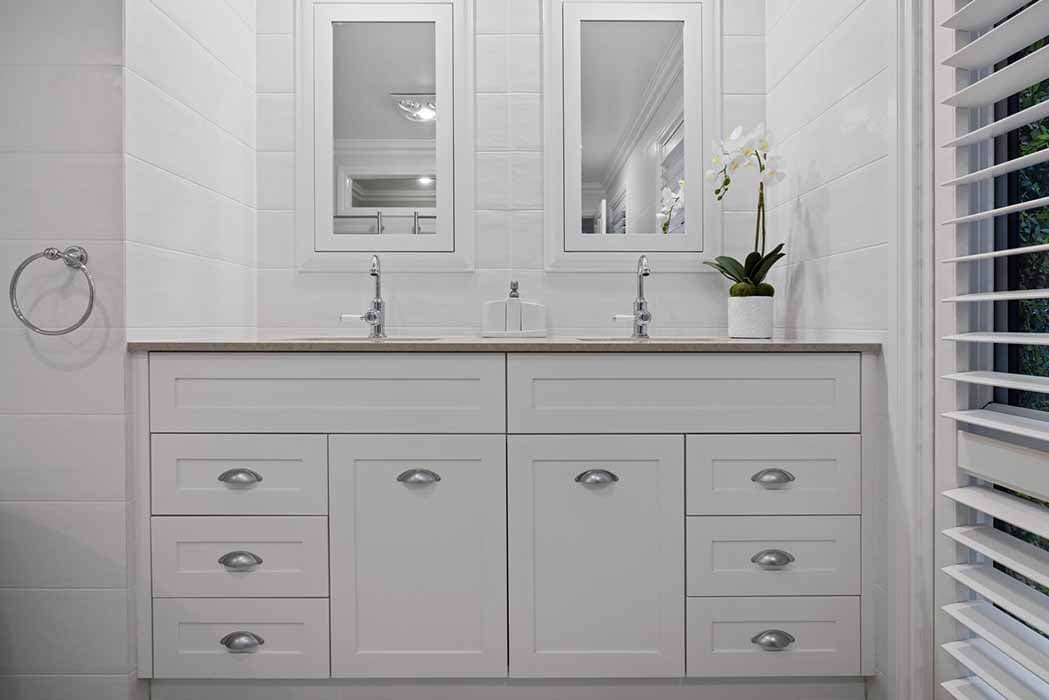 Modern bathroom renovation in Canberra, featuring double vanity and elegant finishes.