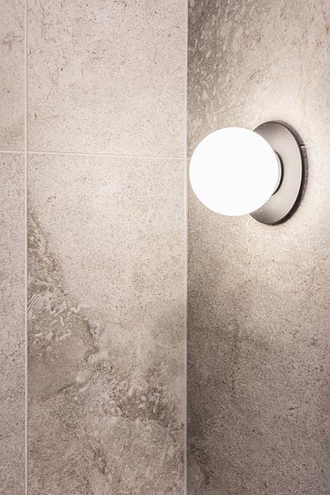 Modern bathroom lighting and grey tiles in Canberra, Australia