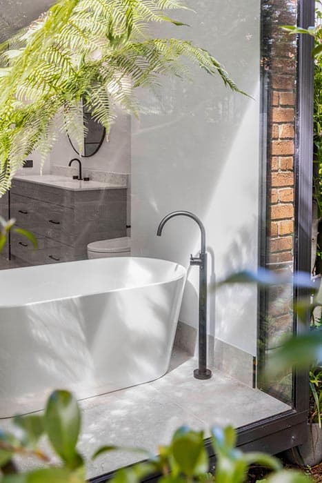 Modern bathroom renovation in Canberra with freestanding tub and sleek finishes