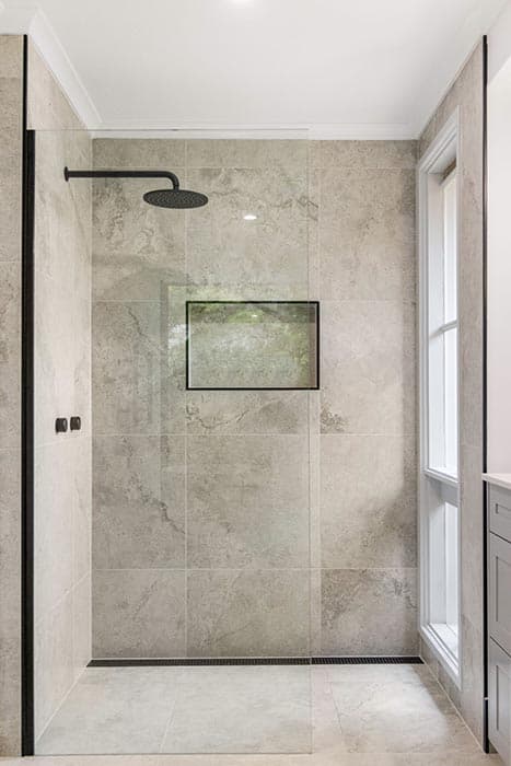Modern bathroom renovation in Canberra with sleek shower design and elegant finishes.