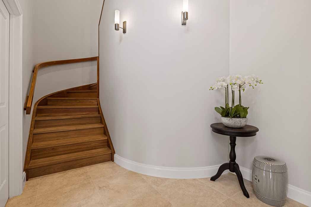 Elegant entryway renovation in Canberra, Australia with modern lighting and stylish decor.