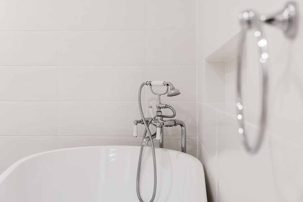 Modern bathroom renovation in Canberra with freestanding tub and elegant fixtures