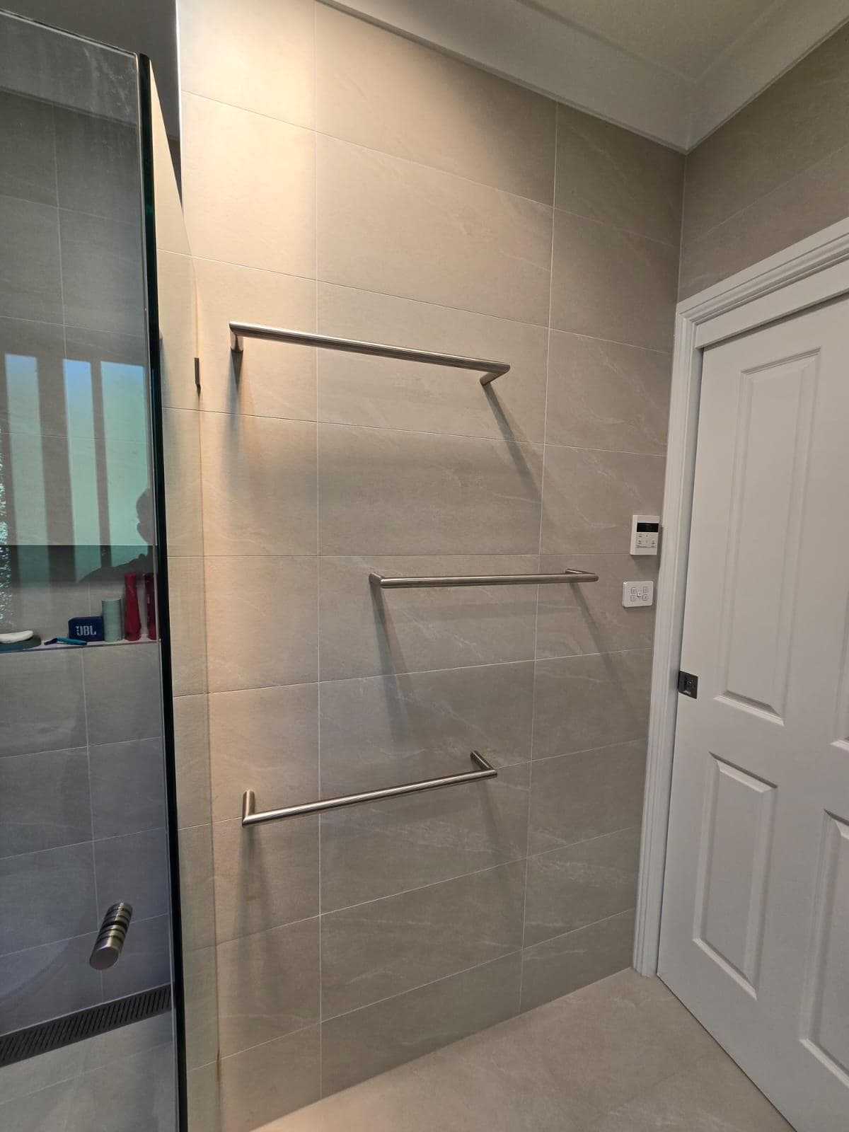 Modern bathroom renovation in Jerrabomberra, Canberra with sleek finishes and fixtures.