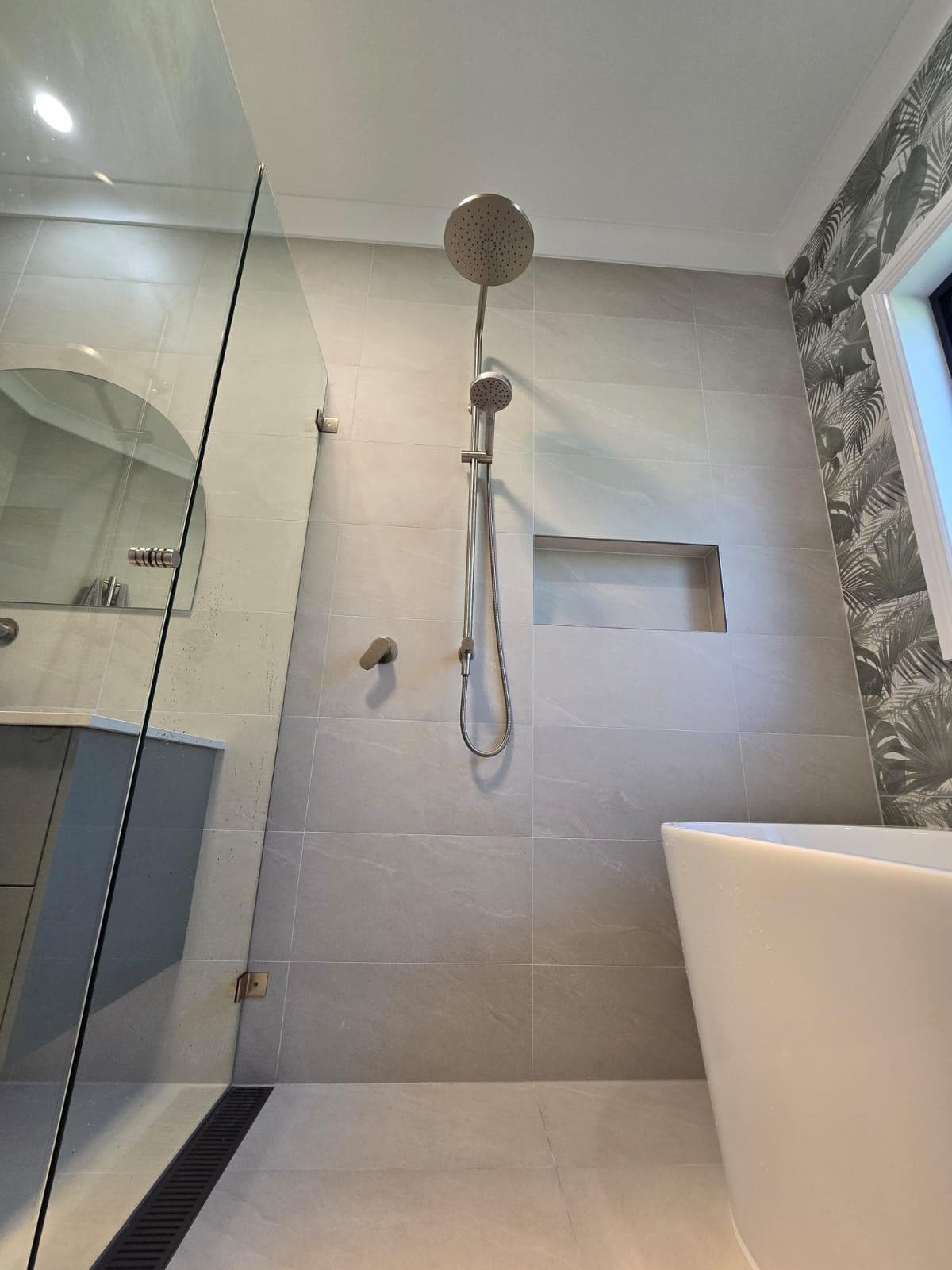 Modern bathroom renovation in Canberra with sleek finishes and stylish design.