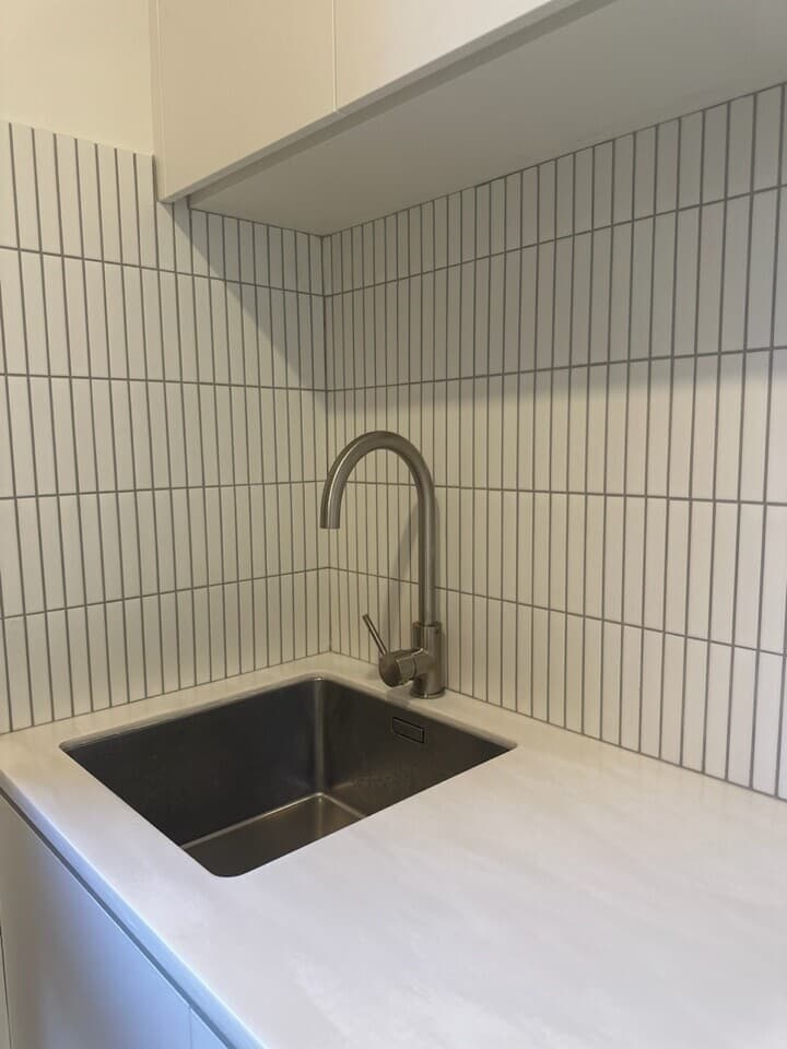 Modern kitchen renovation in Canberra with sleek finishes and stylish fixtures.