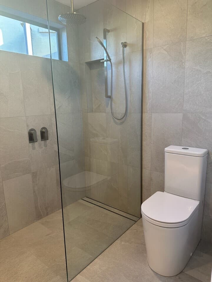 Modern bathroom renovation in Canberra with walk-in shower and sleek fixtures