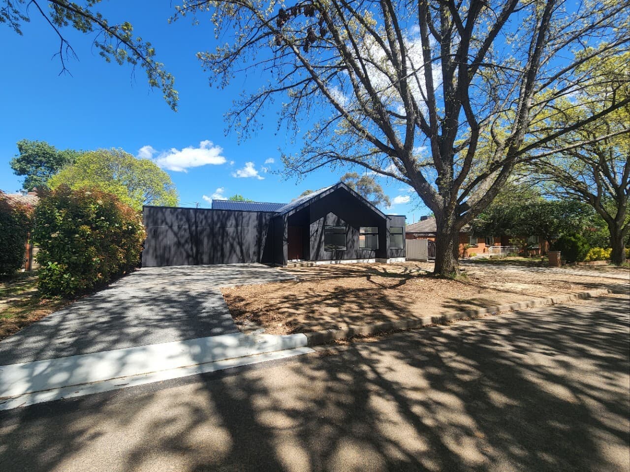 Modern home renovation in Canberra, Australia with stylish facade and landscaped entrance.